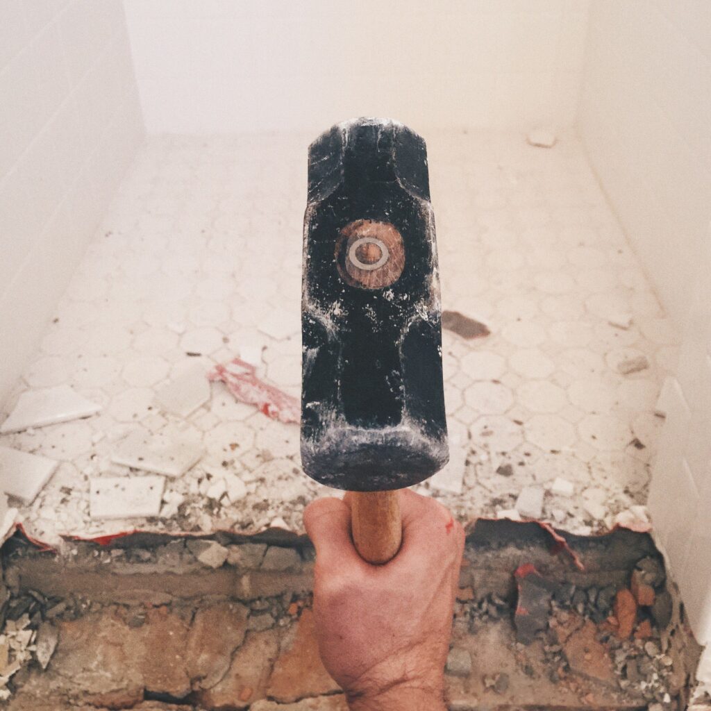 Breaking a floor with a mallet